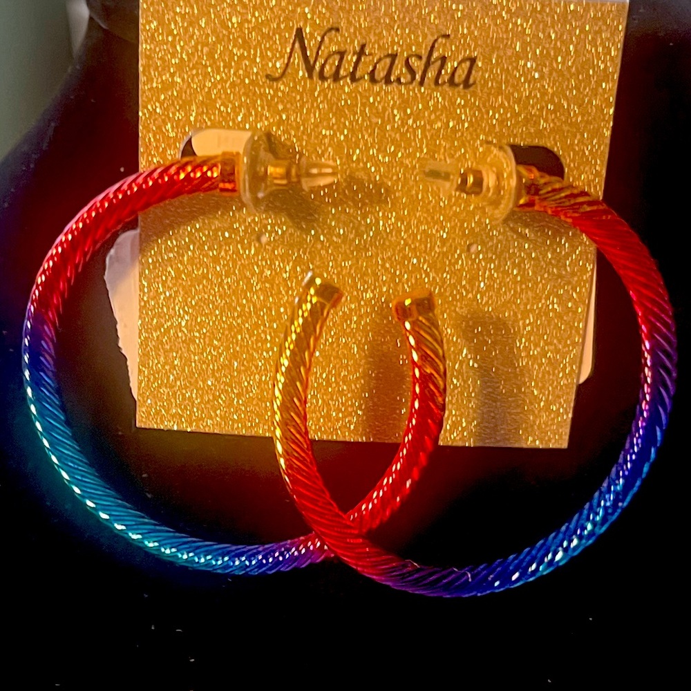 Natasha twisted hoop earring. Rainbow metal tone colors .